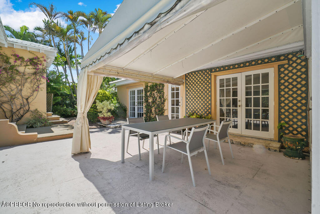 257 Fairview Road Palm Beach, FL 33480 - Photo 18 of 30 a dining room with furniture and a potted plant