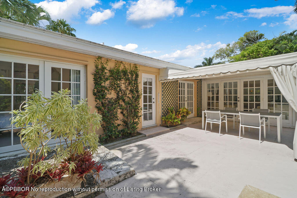 257 Fairview Road Palm Beach, FL 33480 - Photo 19 of 30 a house view with a garden space