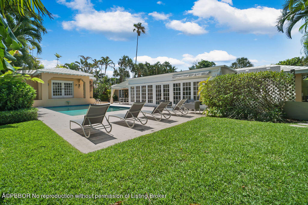 257 Fairview Road Palm Beach, FL 33480 - Photo 27 of 30 a view of a backyard with sitting area