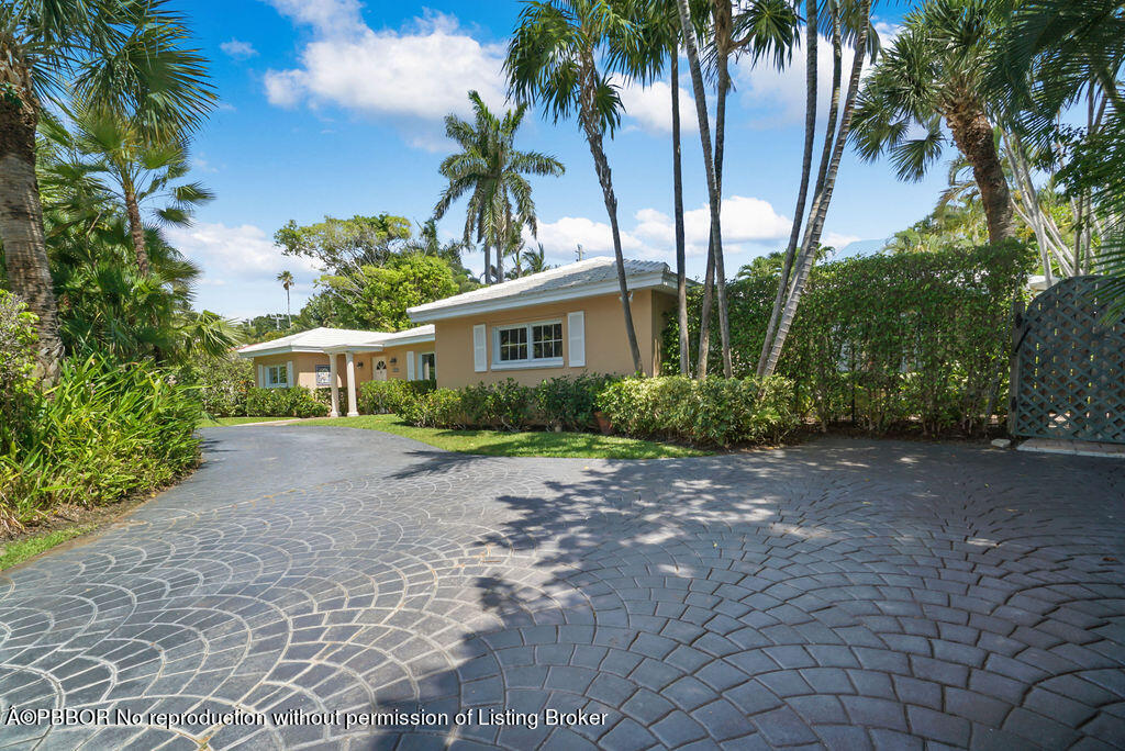 257 Fairview Road Palm Beach, FL 33480 - Photo 30 of 30 a view of a house with a yard and plant