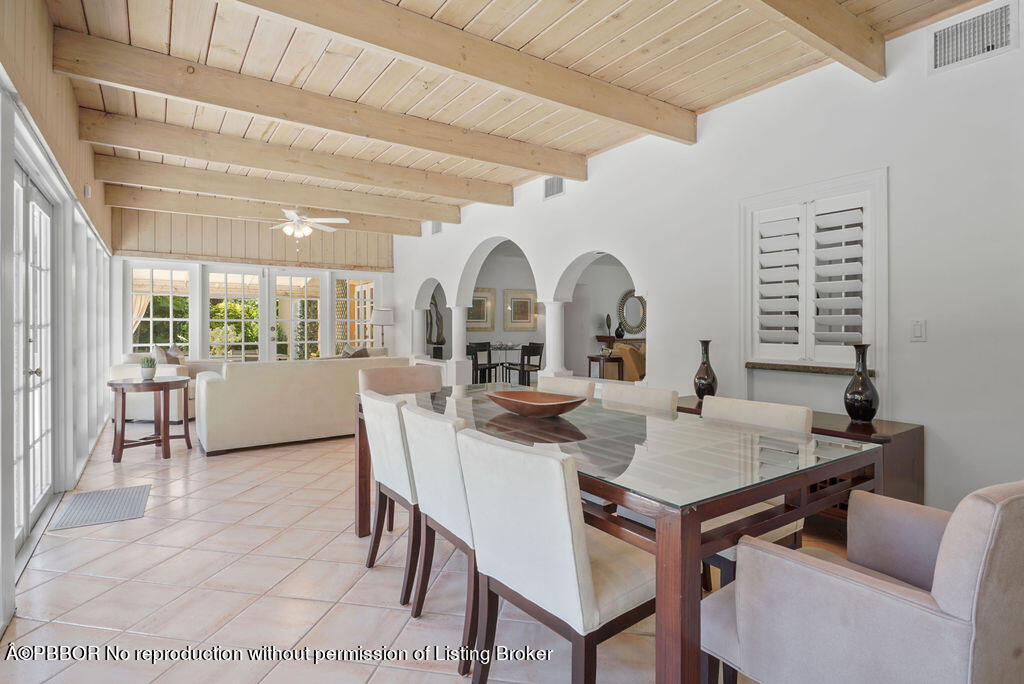 257 Fairview Road Palm Beach, FL 33480 - Photo 4 of 30 a view of a dining room with furniture and wooden floor