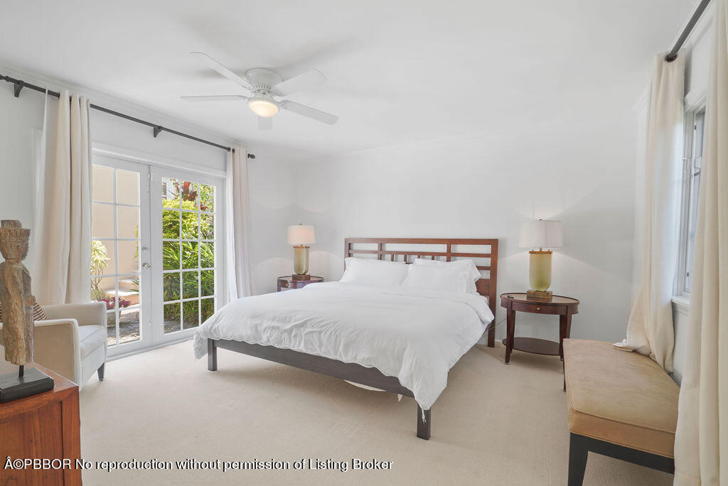 257 Fairview Road Palm Beach, FL 33480 - Photo 8 of 30 a bedroom with a bed and a large window