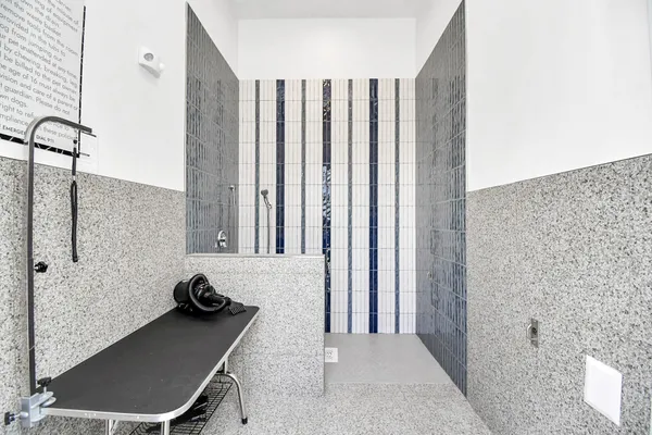 a view of a bathroom with a tub and shower
