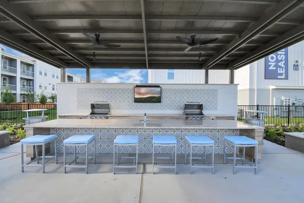 a view of a kitchen with a table and chairs