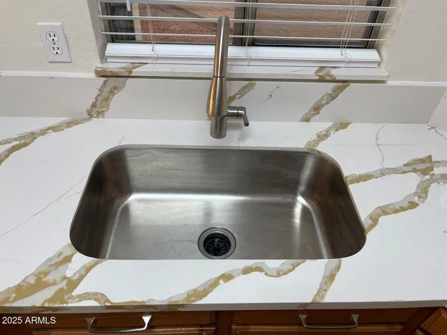 a close view of a sink and an oven