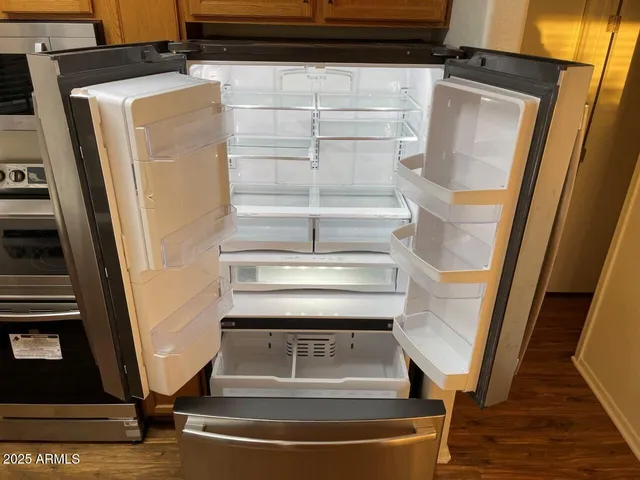 a room with a closet and wooden floor