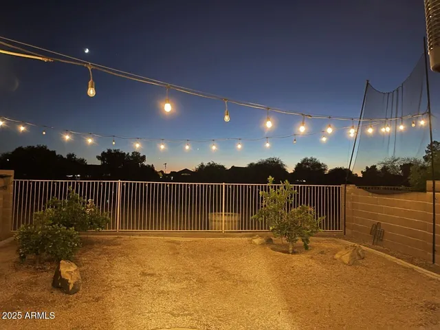 a kitchen with stainless steel appliances granite countertop a refrigerator a stove and a sink