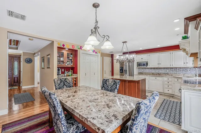 a view of a kitchen counter top space and wooden floor