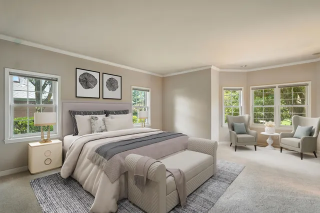 a bedroom with a large bed and a couch