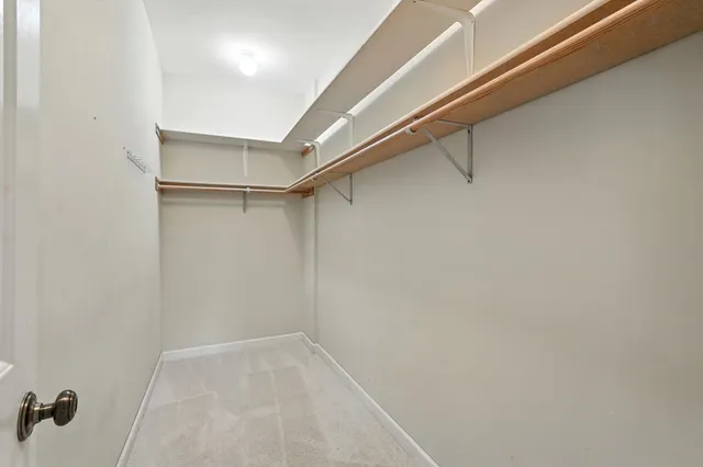 a view of an empty walk in closet