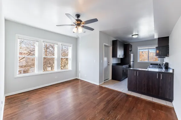 a view of a kitchen with a sink cabinets and wooden floor