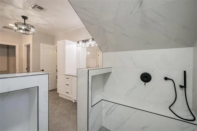 a bathroom with a bathtub and sink