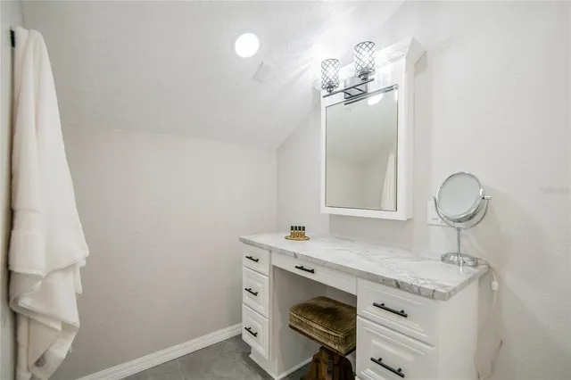 a kitchen with granite countertop lots of counter top space and dining table