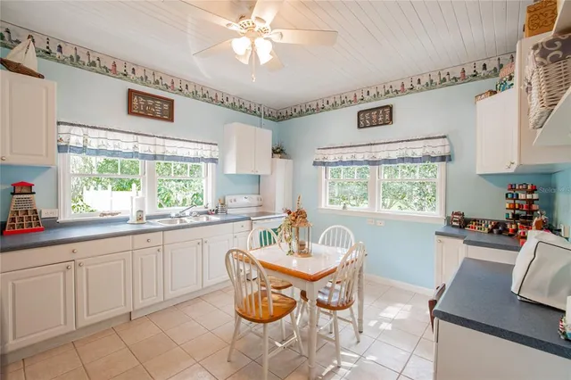 a utility room with sink dryer and washer