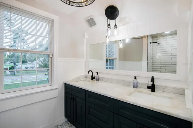 a front view of house with yard and outdoor seating