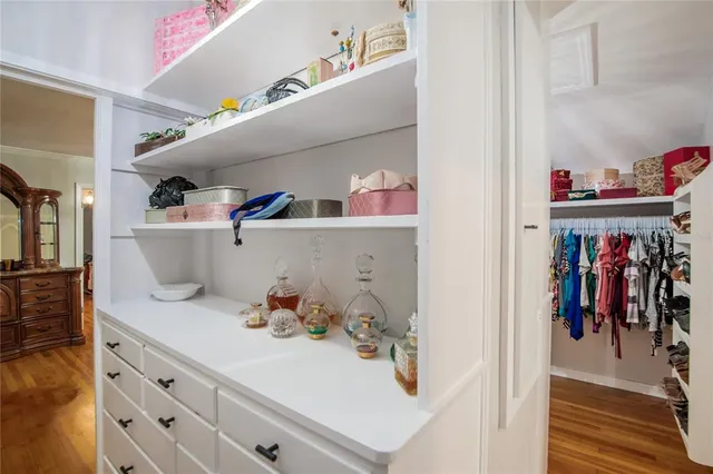 an aerial view of house with yard and mountain view in back