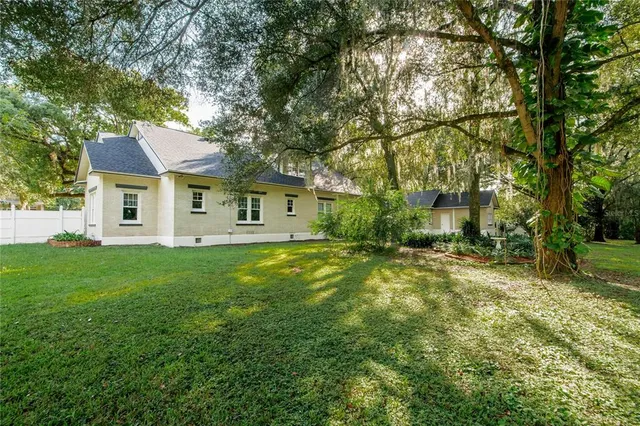 a living room with furniture a mirror and a fireplace