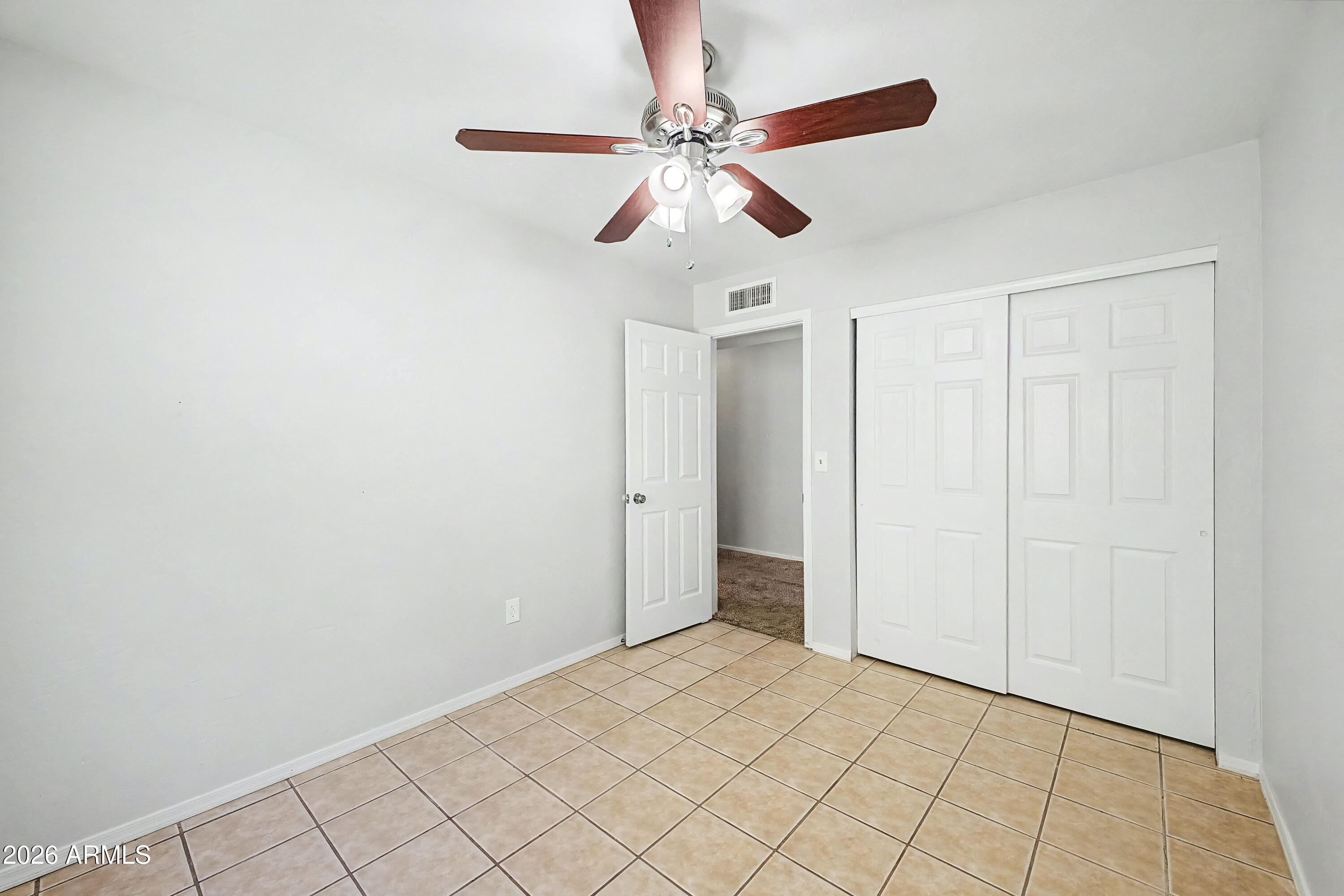 3134 East McKellips Road, Unit 221 Mesa, AZ 85213 - Photo 21 of 29 a view of an empty room and window