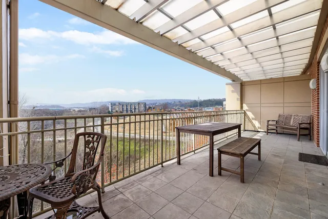 a view of a chairs in wooden deck