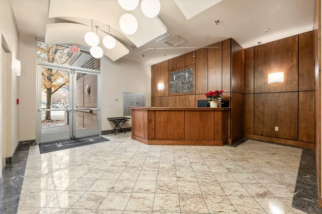 a view of a patio with table and chairs