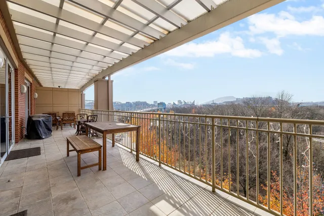 a kitchen with a white stove top oven and cabinets