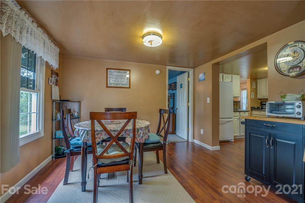 400 Howard Cole Road Rutherfordton, NC 28139 - Photo 11 of 29 a view of a dining room with furniture and wooden floor