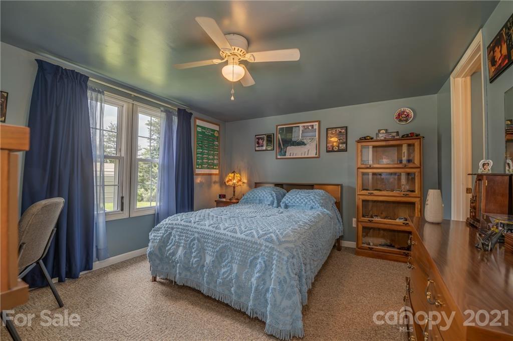 400 Howard Cole Road Rutherfordton, NC 28139 - Photo 12 of 29 a bedroom with a bed furniture and a large window