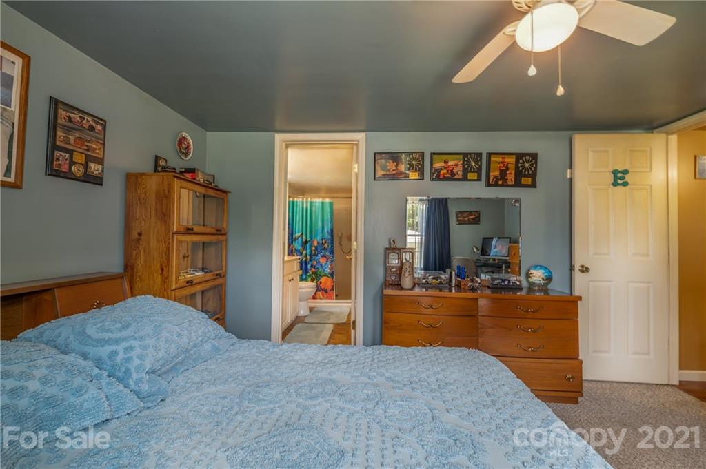 400 Howard Cole Road Rutherfordton, NC 28139 - Photo 13 of 29 a bedroom with bed and wooden floor