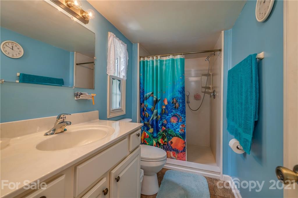 400 Howard Cole Road Rutherfordton, NC 28139 - Photo 14 of 29 a bathroom with a sink toilet and shower
