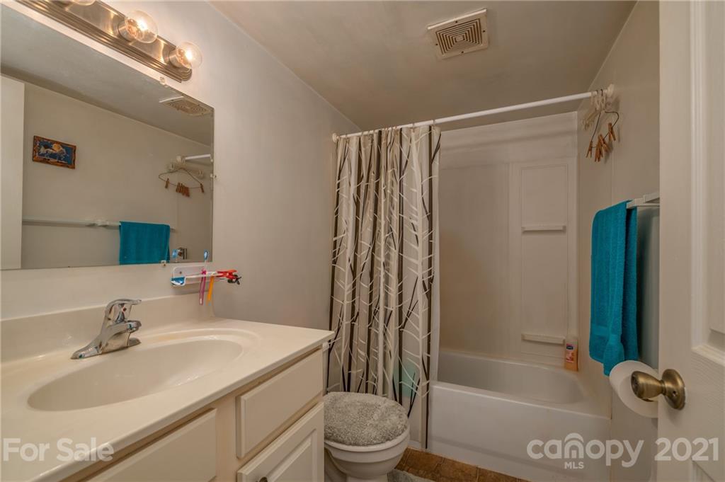 400 Howard Cole Road Rutherfordton, NC 28139 - Photo 16 of 29 a bathroom with a sink toilet and shower