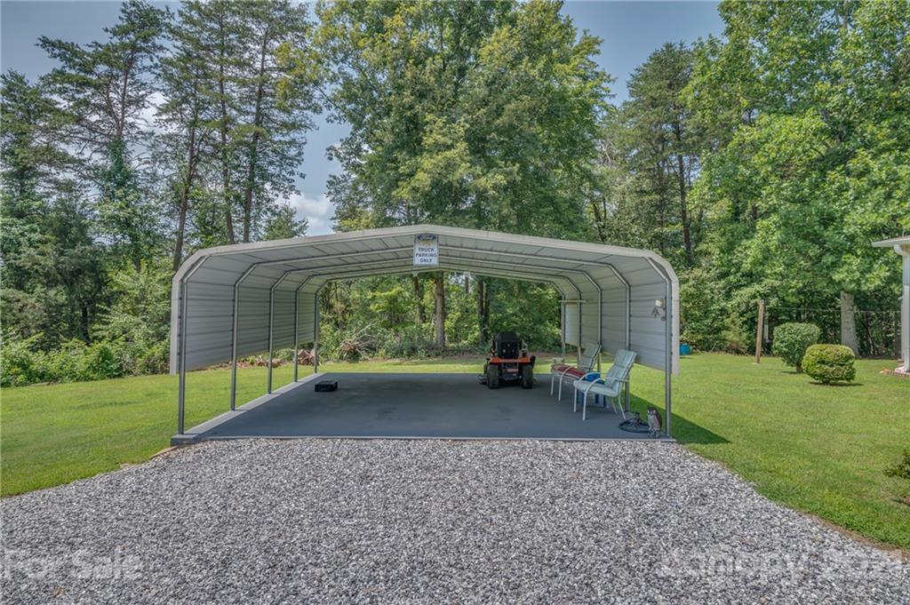 400 Howard Cole Road Rutherfordton, NC 28139 - Photo 20 of 29 a view of a house with backyard and sitting area