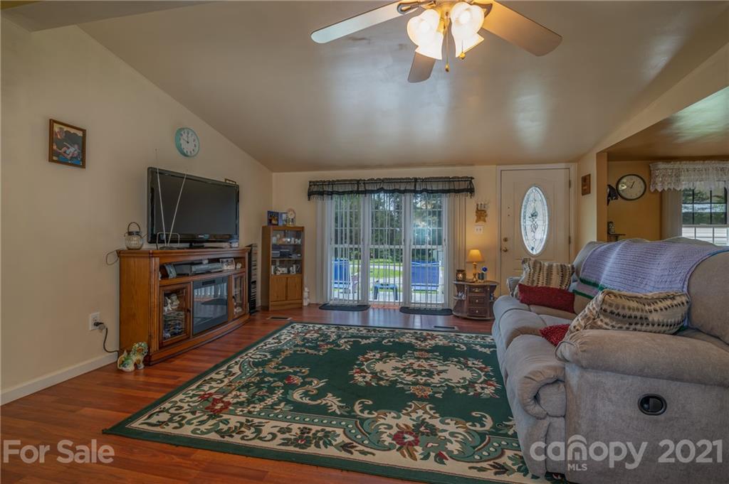 400 Howard Cole Road Rutherfordton, NC 28139 - Photo 3 of 29 a living room with furniture and a flat screen tv