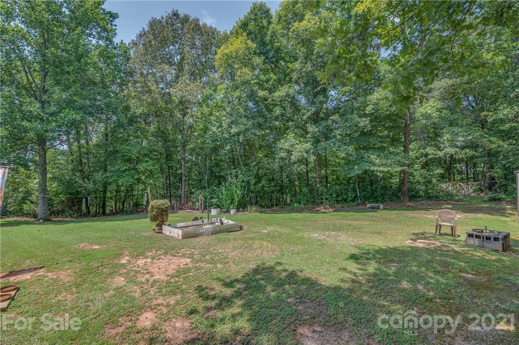 400 Howard Cole Road Rutherfordton, NC 28139 - Photo 24 of 29 a backyard of a house with table and chairs