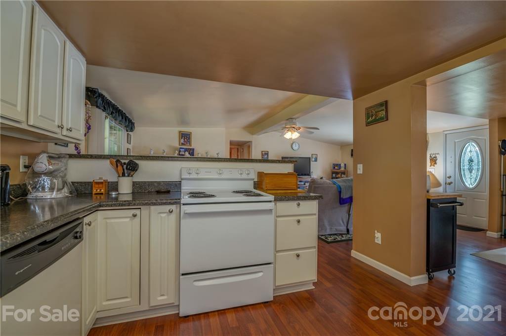 400 Howard Cole Road Rutherfordton, NC 28139 - Photo 9 of 29 a kitchen with a sink cabinets and wooden floor