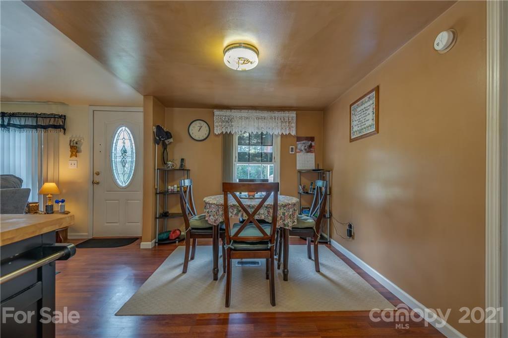 400 Howard Cole Road Rutherfordton, NC 28139 - Photo 10 of 29 a view of a dining room with furniture and wooden floor