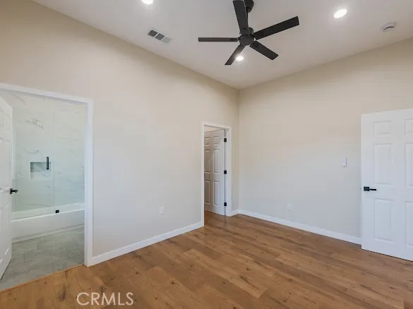 a bathroom with a bathtub shower sink vanity and toilet