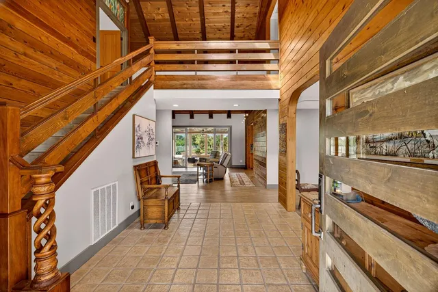 a bathroom with a toilet a sink and a mirror