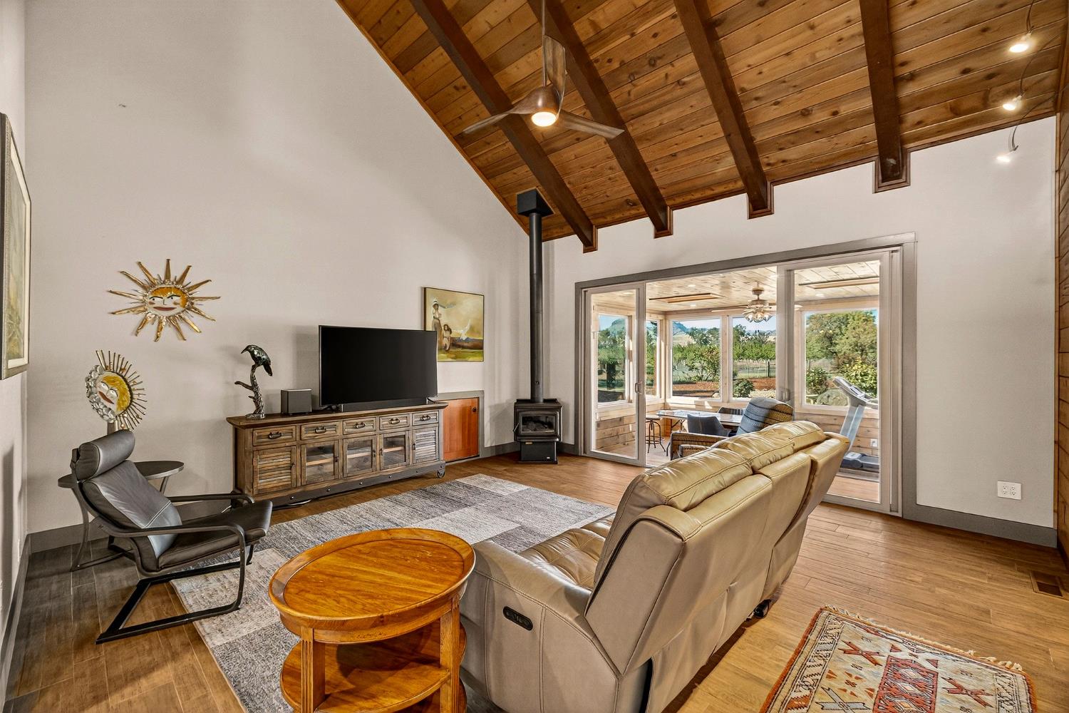 8617 South Butte Road Sutter, CA 95982 - Photo 13 of 64 a living room with furniture a flat screen tv and a floor to ceiling window