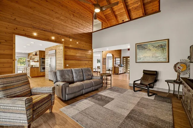 a view of a livingroom with furniture and workspace