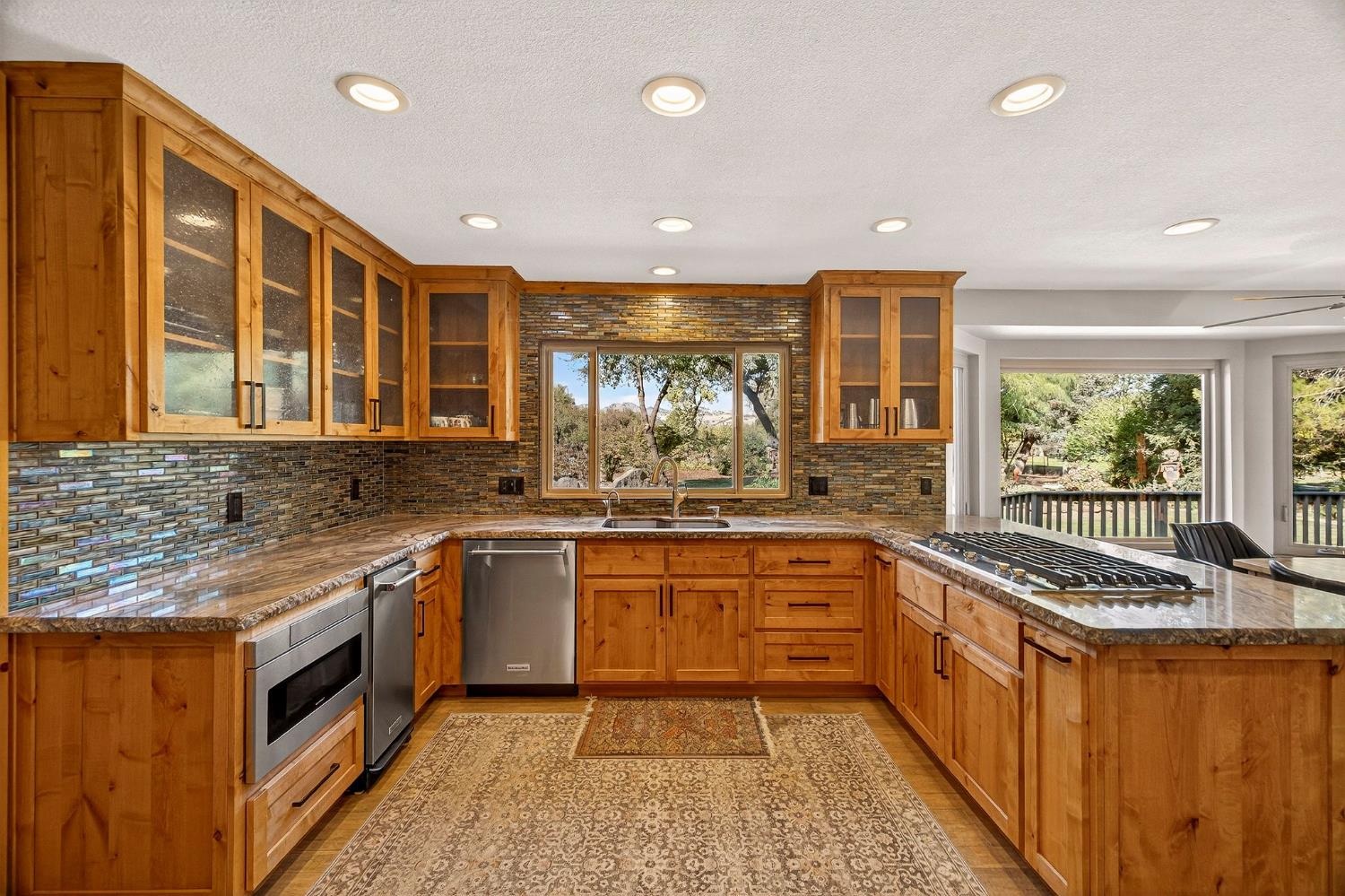 8617 South Butte Road Sutter, CA 95982 - Photo 16 of 64 a kitchen with stainless steel appliances a sink stove and cabinets