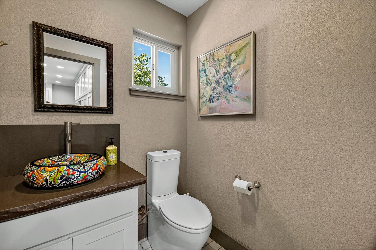 8617 South Butte Road Sutter, CA 95982 - Photo 23 of 64 a bathroom with a toilet a sink and a mirror