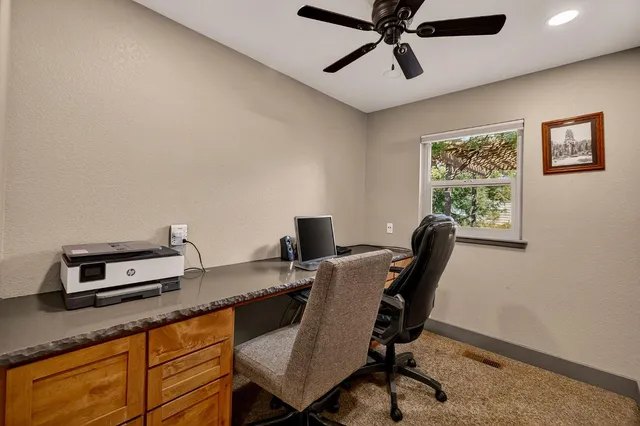 a bathroom with a toilet and a mirror