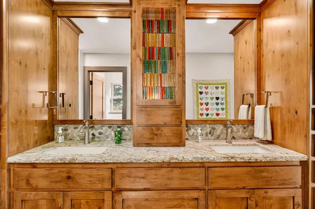 a open kitchen with stainless steel appliances granite countertop a stove and a sink