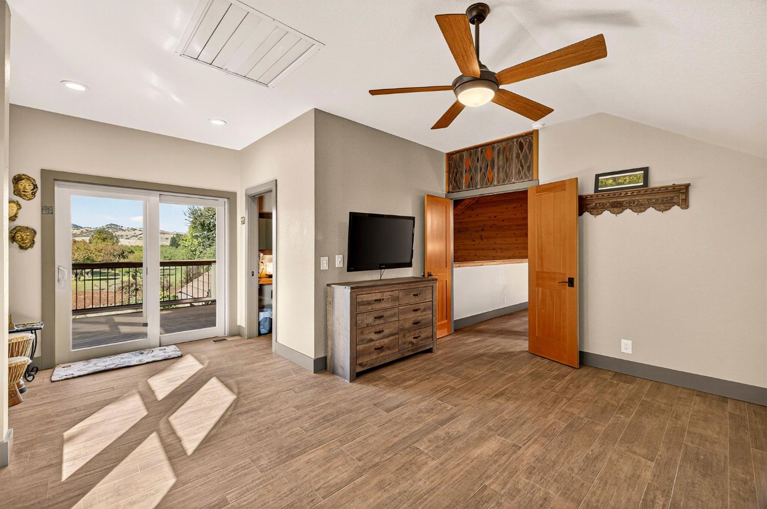 8617 South Butte Road Sutter, CA 95982 - Photo 34 of 64 a view of a livingroom with wooden floor and a ceiling fan
