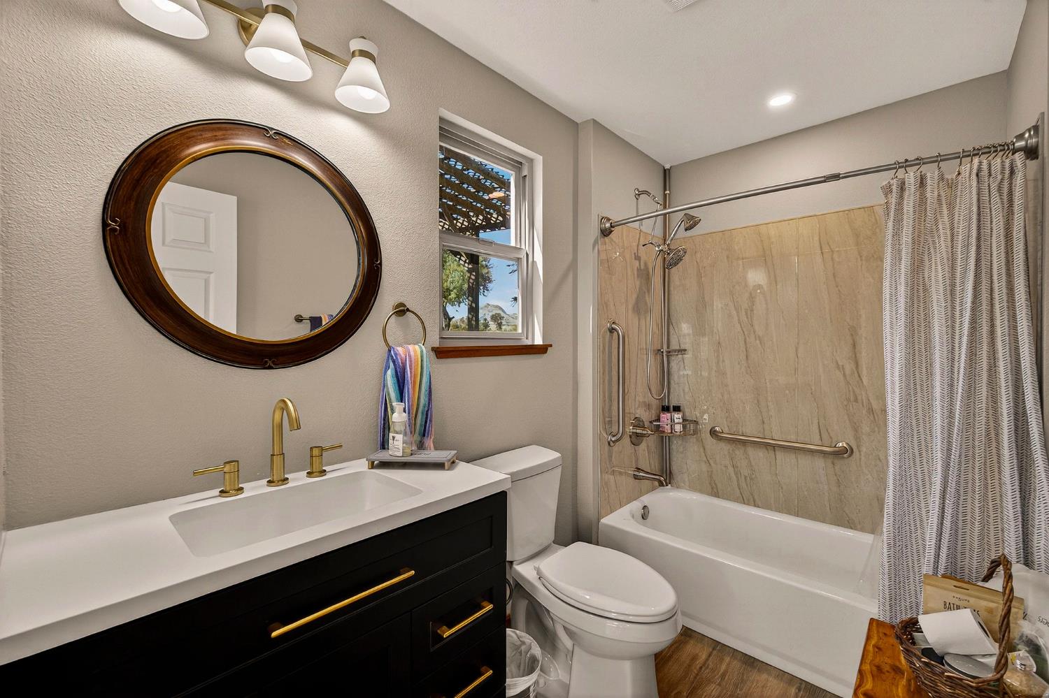 8617 South Butte Road Sutter, CA 95982 - Photo 59 of 64 a bathroom with a sink a toilet and a mirror