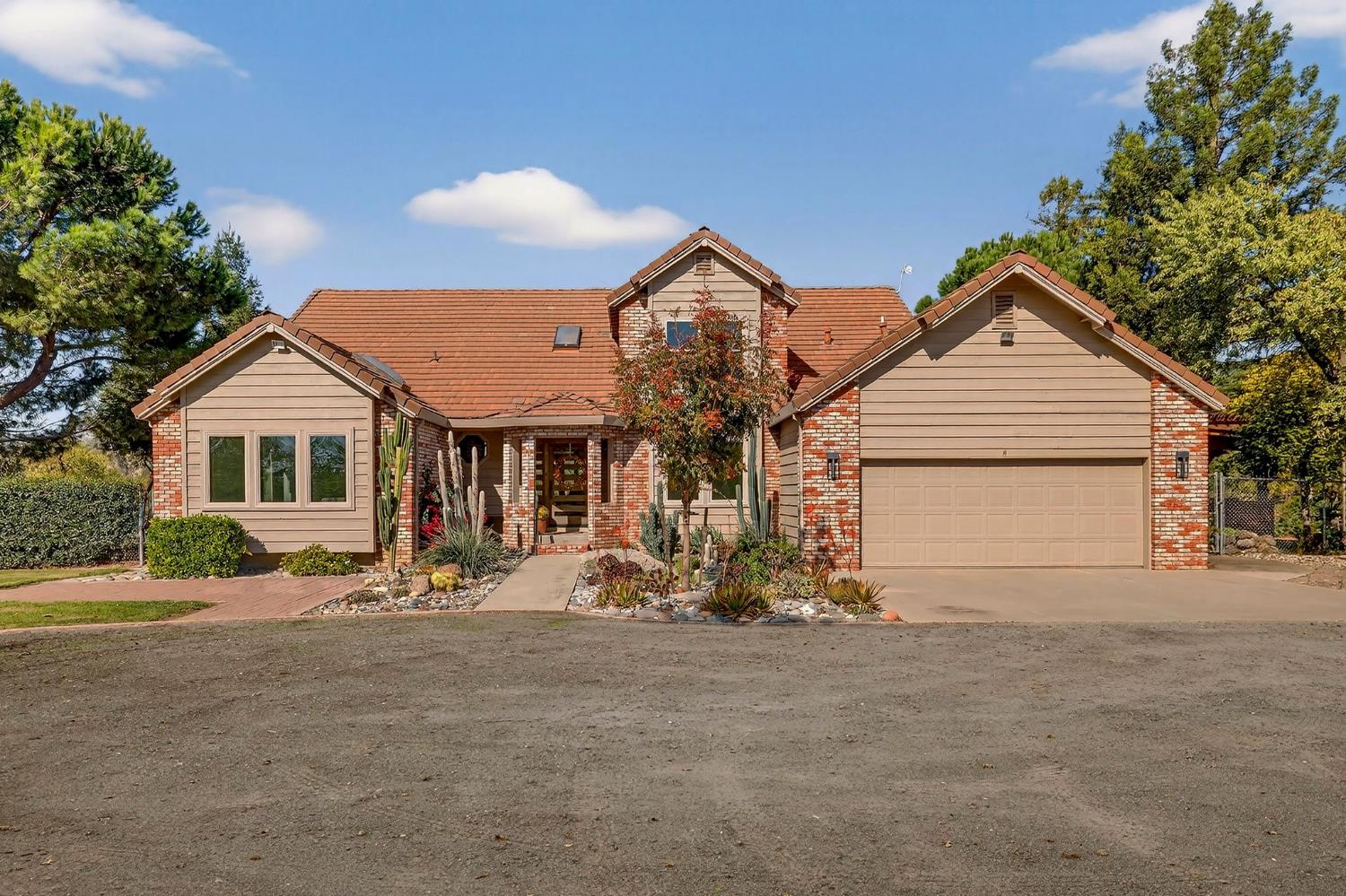 8617 South Butte Road Sutter, CA 95982 - Photo 64 of 64 a front view of house with yard outdoor seating and garage