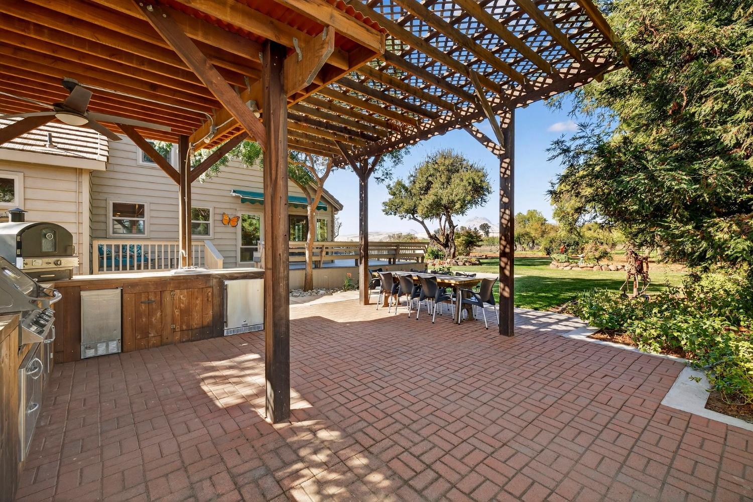 8617 South Butte Road Sutter, CA 95982 - Photo 8 of 64 a view of a patio with table and chairs and potted plants