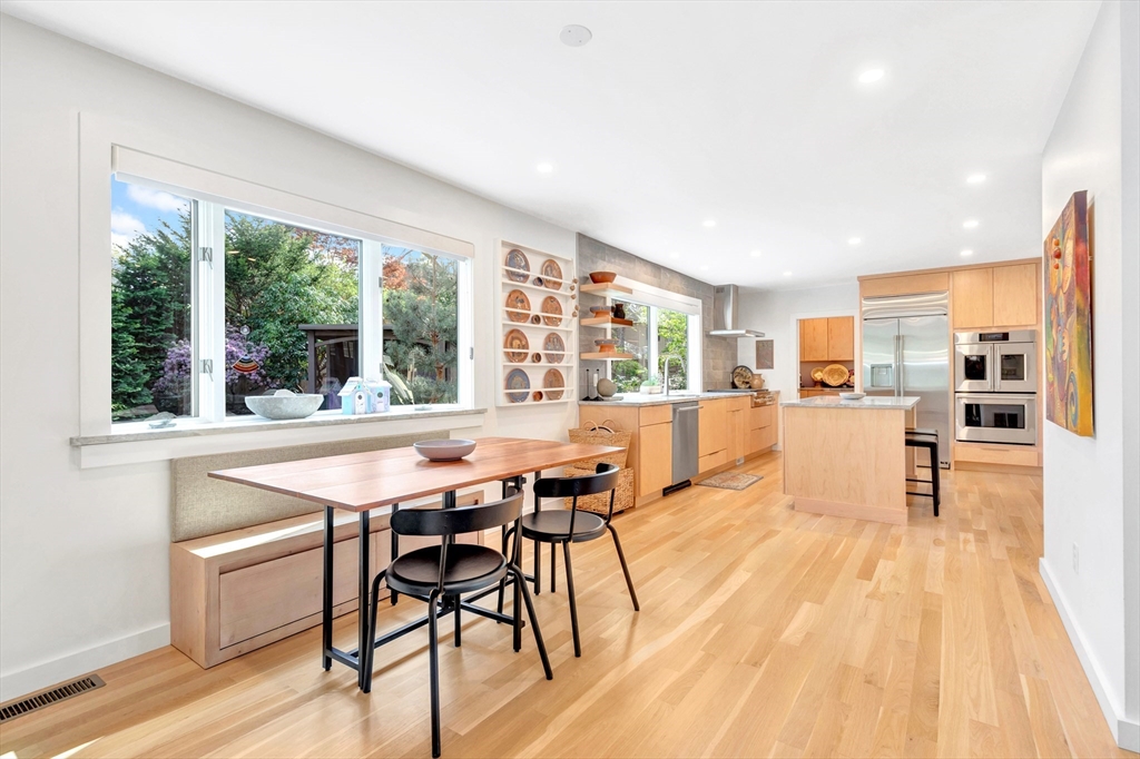 40 Holland Road Melrose, MA 02176 - Photo 12 of 42 a view of a dining room with furniture window and wooden floor