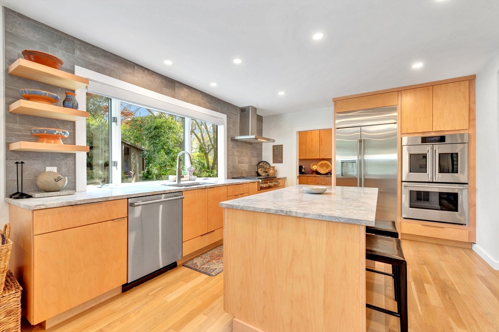 40 Holland Road Melrose, MA 02176 - Photo 13 of 42 a kitchen with stainless steel appliances granite countertop sink stove and refrigerator