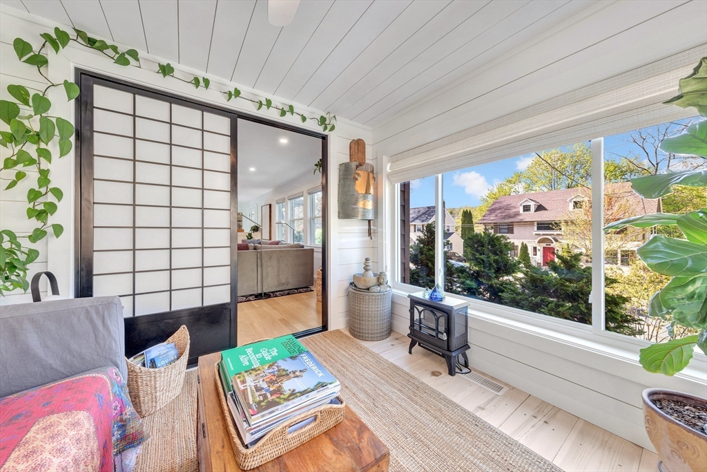 40 Holland Road Melrose, MA 02176 - Photo 17 of 42 a living room with furniture and a floor to ceiling window